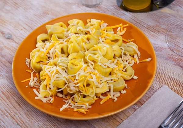 Tortellini with two varieties of grated cheese and pine nuts — Stock Photo, Image