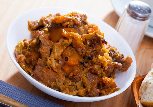 Juicy pork with stewed cabbage — Stock Photo, Image