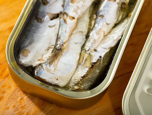 Open can of sardines in oil — Stock Image Open can of sardines in oil Stock Photo