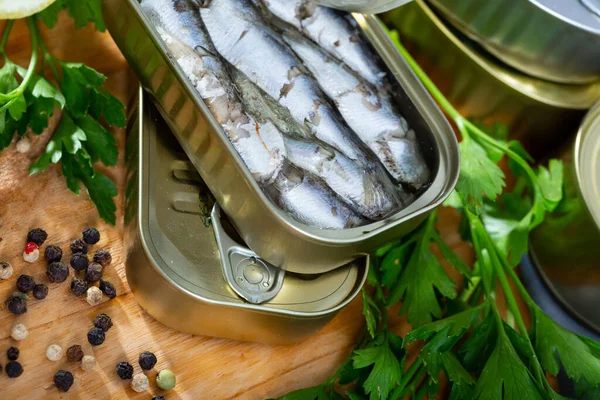 Pilchards in oil with greens and lemon — Stock Image Pilchards in oil with greens and lemon Royalty Free Stock Images