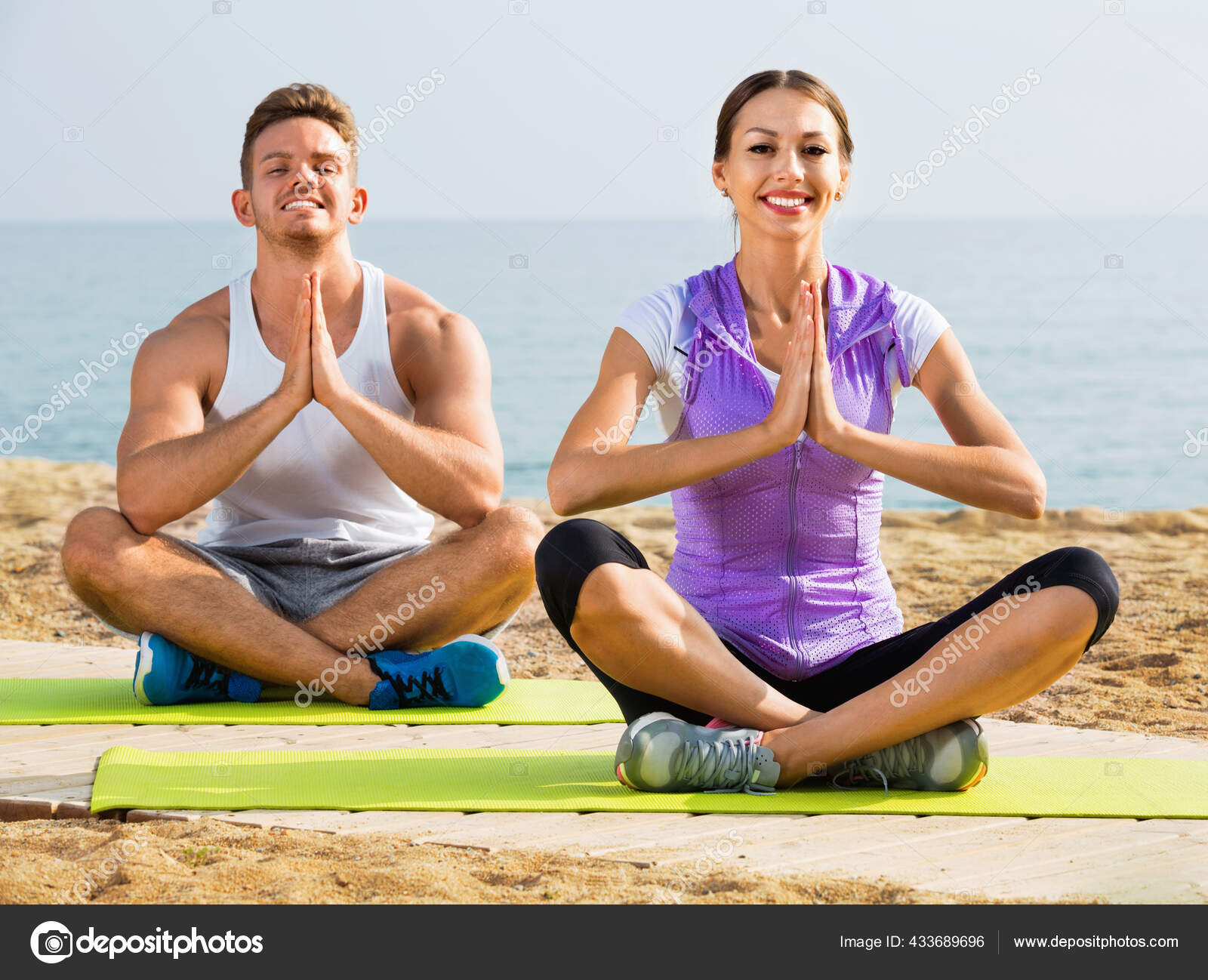 Female Doing Yoga Poses On Sunny Morning In The Green Garden Stock