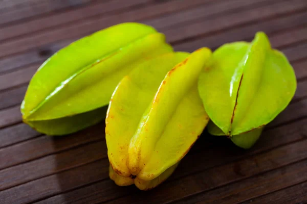 Carambola fruit on wooden table closeup — Stock Photo, Image