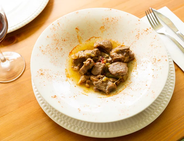 Lamb stew with garlic shoots seasoned with smoked paprika — Stock Photo, Image