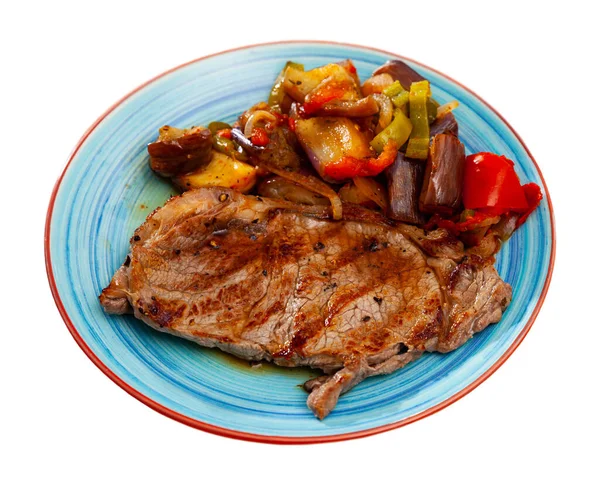 Grilled beef steak served with baked vegetables at plate — Stock Photo, Image