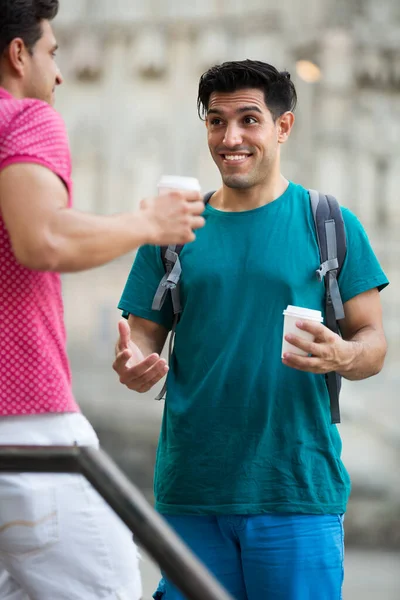 Adult men are drinking coffee and talking — Stock Photo, Image