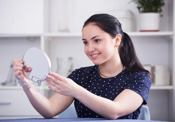 Cheerful gir looking in mirror — Stock Photo, Image