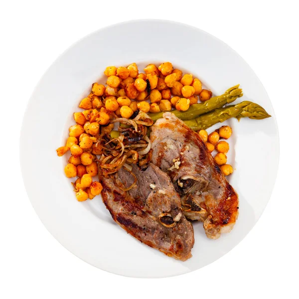 Roasted lamb steak with chickpeas and asparagus on white plate — Stock Photo, Image