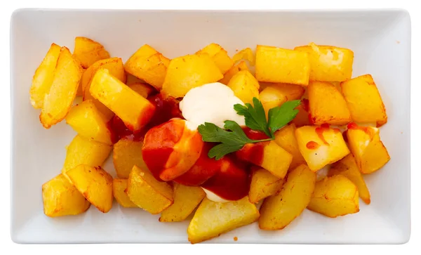 Spanish dish Patatas bravas with hot sauce — Stock Photo, Image