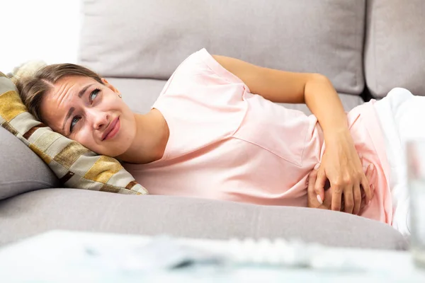 Mujer infeliz con dolor de estómago —  Fotos de Stock