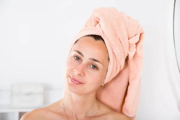 Adult woman with a towel on her head — Stock Photo, Image