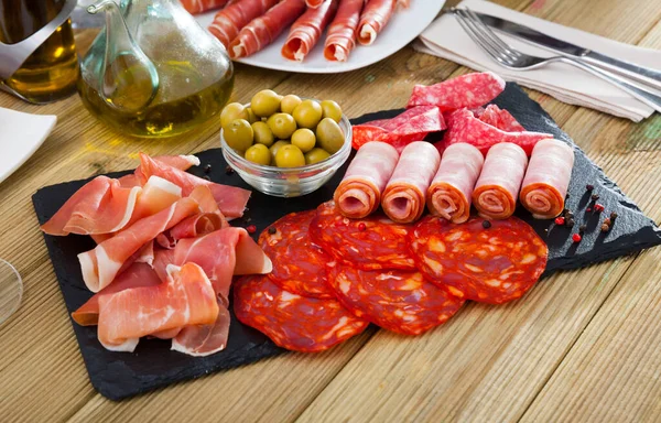 Meat platter on slate board — Stock Photo, Image