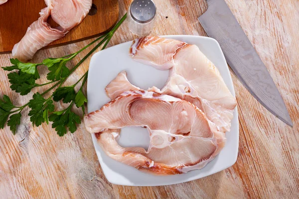 Uncooked tiger shark fillet fish with parsley and lemon on table — Stock Photo, Image