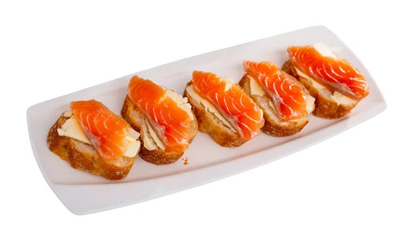 Sandwiches with smoked salmon and butter on white plate — Stock Photo, Image
