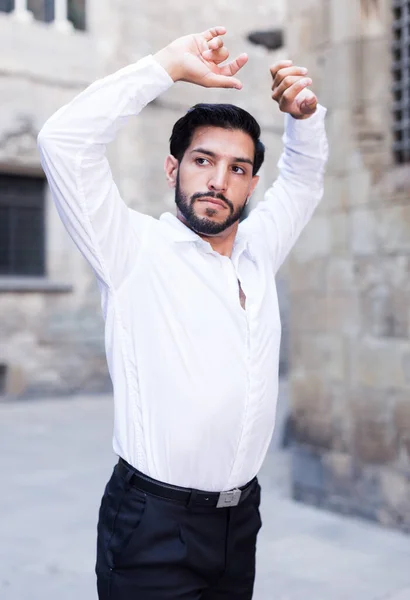 Young man dancing near old castle — Stock Photo, Image