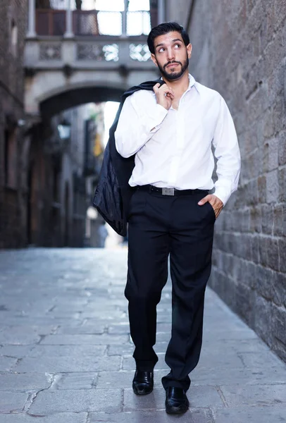 Man walking along old town street — Stock Photo, Image