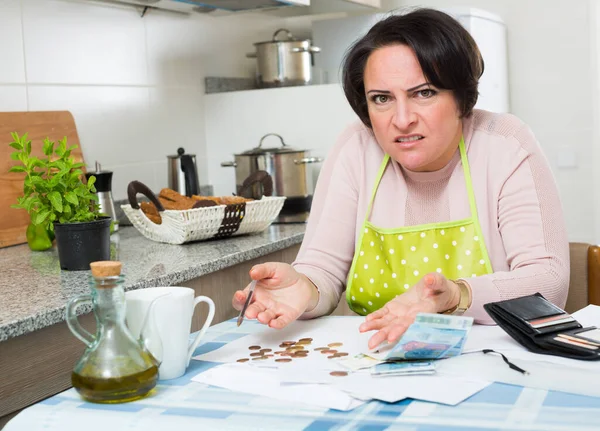 Miserable female counting money for payment — Stock Photo, Image