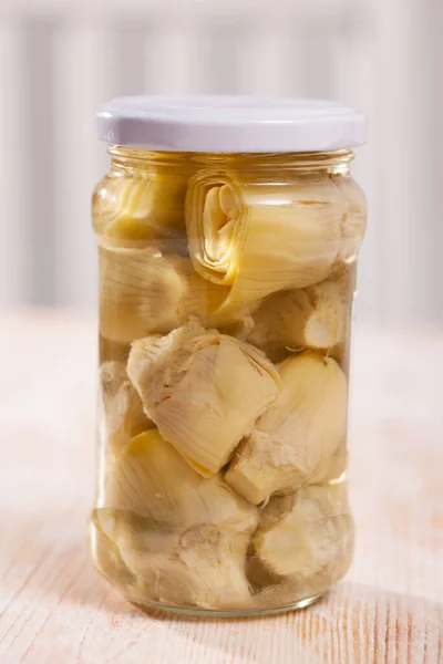 Pickled artichokes in glass jar — Stock Photo, Image