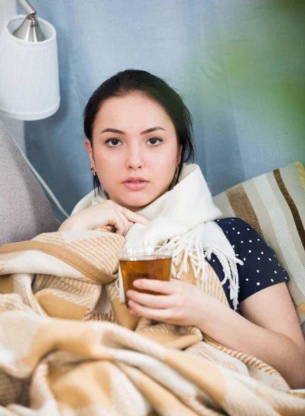 Sick girl under blanket — Stock Photo, Image