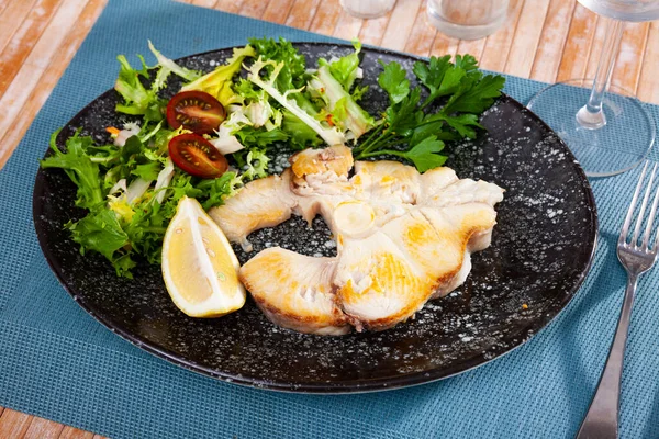 Dish of ocean fish tintorera with lemon and herbs. — Stock Photo, Image