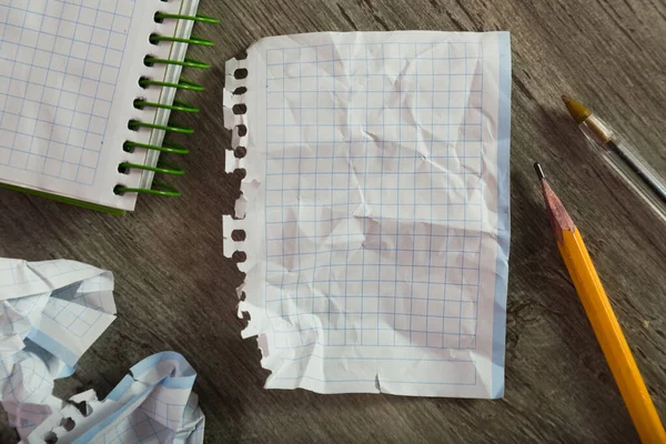 Torn crumpled notebook sheet — Stock Photo, Image