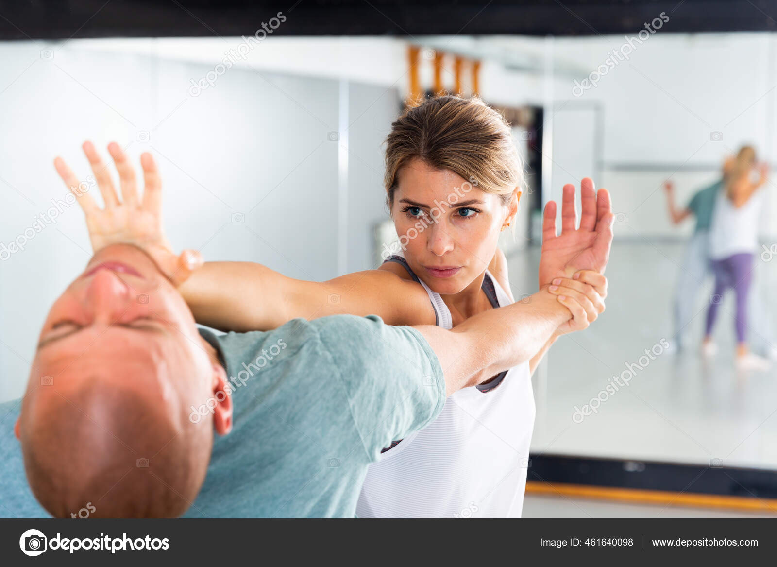 Woman Performing Palm Heel Strike While Training In Gym Stock Photo By C Jim Filim