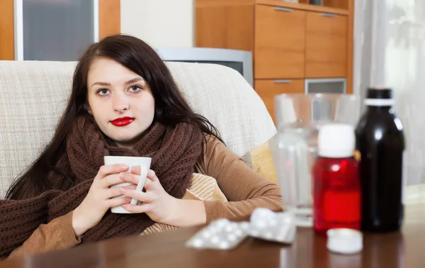 Sick girl with medications — Stock Photo, Image