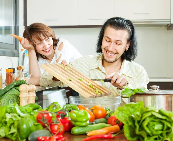 Loving happy couple cooking veggy lunch — Stock Photo, Image