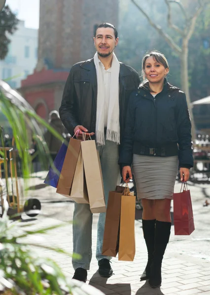 Joyful couple with purchases — Stock Photo, Image