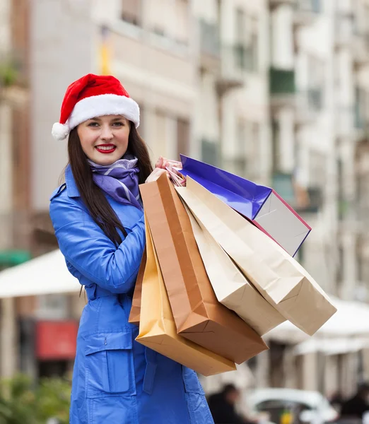 Woman with purchases at street — Stock Photo, Image