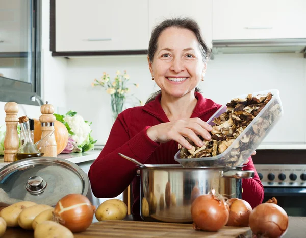 Woman holding dried mushrooms — Stock Photo, Image