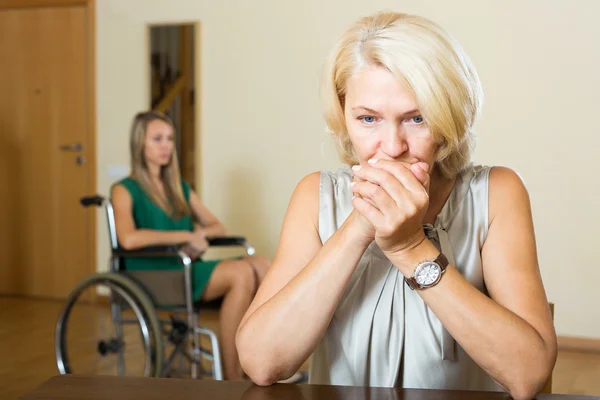 Upset woman and handicapped — Stock Photo, Image