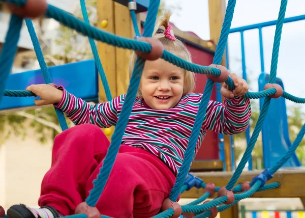 Garota excitada no playground — Fotografia de Stock