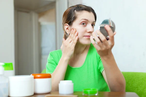 Woman  stares on her skin — Stock Photo, Image