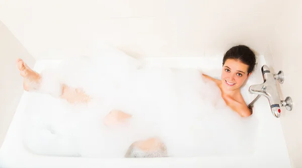 Beautiful girl laying in bath — Stock Photo, Image