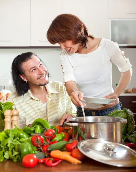 Man and woman with vegetables — Stock Photo, Image
