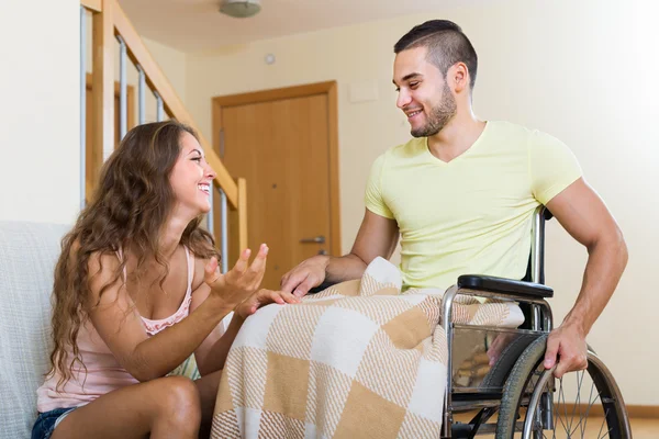 Man in wheelchair and girl — Stock Photo, Image