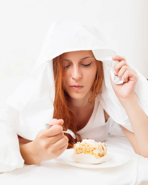 Girl eating biscuit — Stock Photo, Image