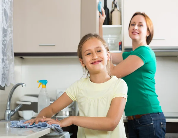 Mother and daughter in kitchen Stock Photo