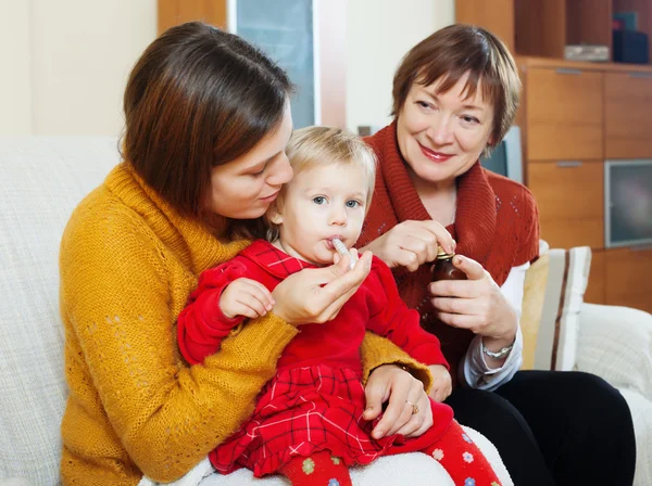 Women caring for baby — Stock Photo, Image