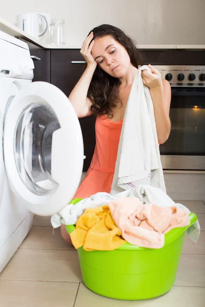 Woman at washing machine — Stock Photo, Image