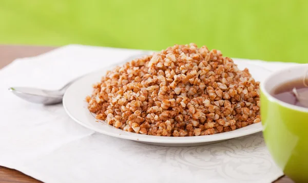 Buckwheat porridge with tea — Stock Photo, Image