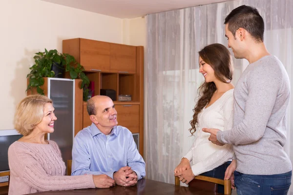 Girl introducing boyfriend to parents — Stock Photo, Image