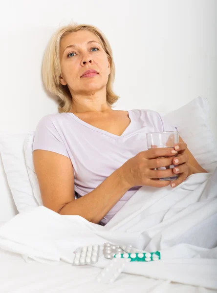 Mature woman with pills — Stock Photo, Image