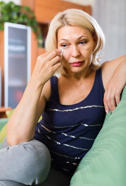 Depressed  mature  woman on sofa — Stock Photo, Image