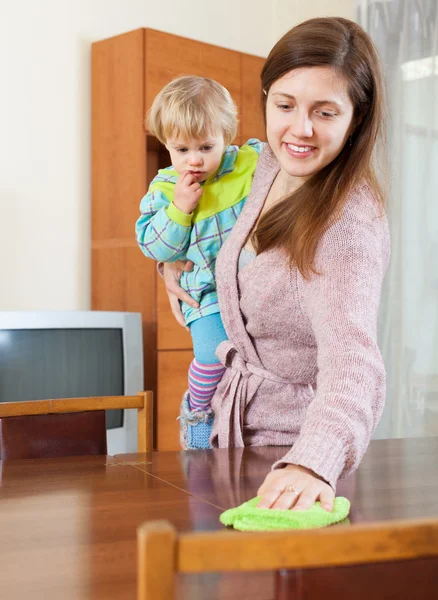 Mother with baby cleaning  home — Stock Photo, Image