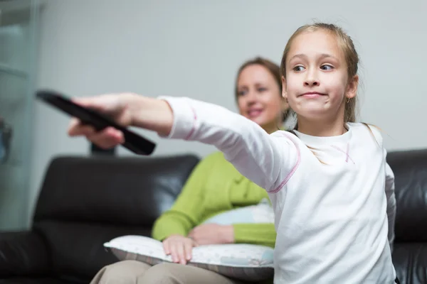 Girl holding remote control — Stock Photo, Image
