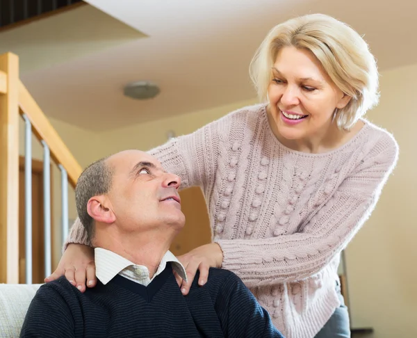 Wife massaging neck to husband — Stock Photo, Image