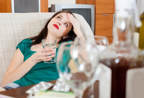 Suffering woman with glass — Stock Photo, Image