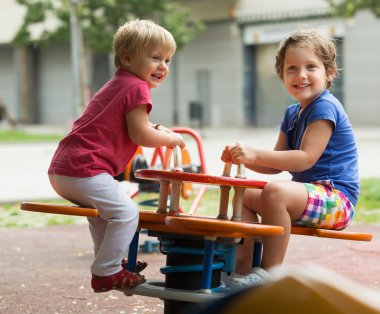 Children having fun at playground   clipart