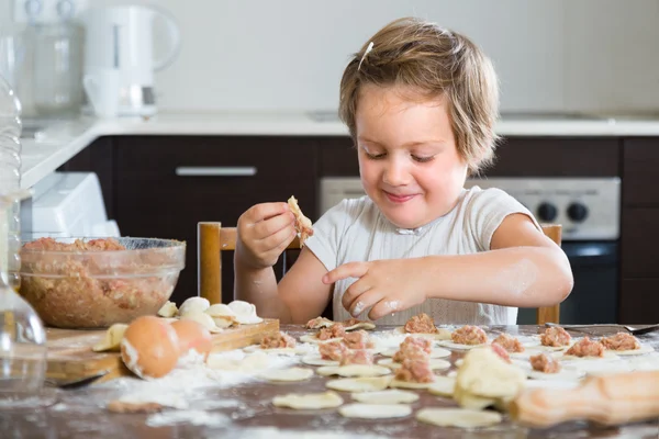Child cooking meat dumplings — Stock Photo, Image